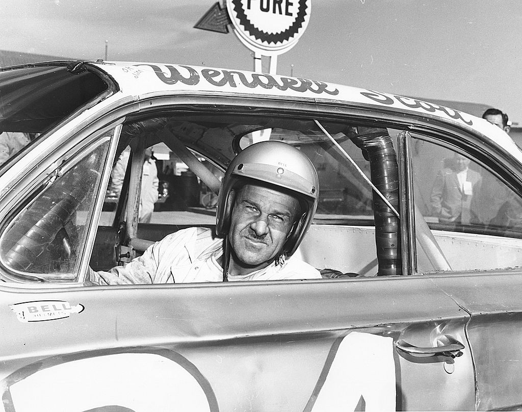 Wendell Scott poses for a portrait in his car as he became the first African-American driver to win in the NASCAR Cup division with a victory in 1963 at Jacksonville Speedway Park in Jacksonville, Florida. Scott was NASCAR's first black competitor, starting in the sportsman class in 1953.