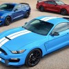 three Mustang GT350s. A red one and dark blue with a candy blue 2017 Ford Mustang in the foreground