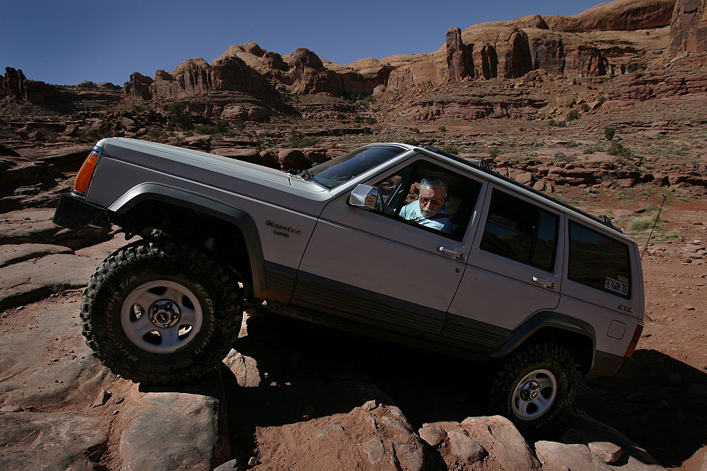 Jeep off-roading over rocks in Moab, Utah