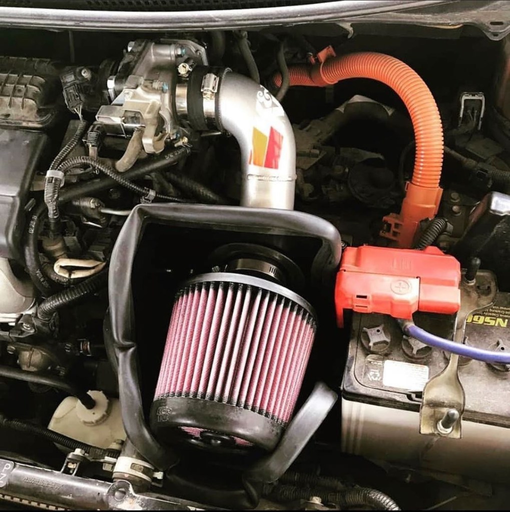A K&N cold-air intake, complete with filter and heat shield, installed in the engine bay