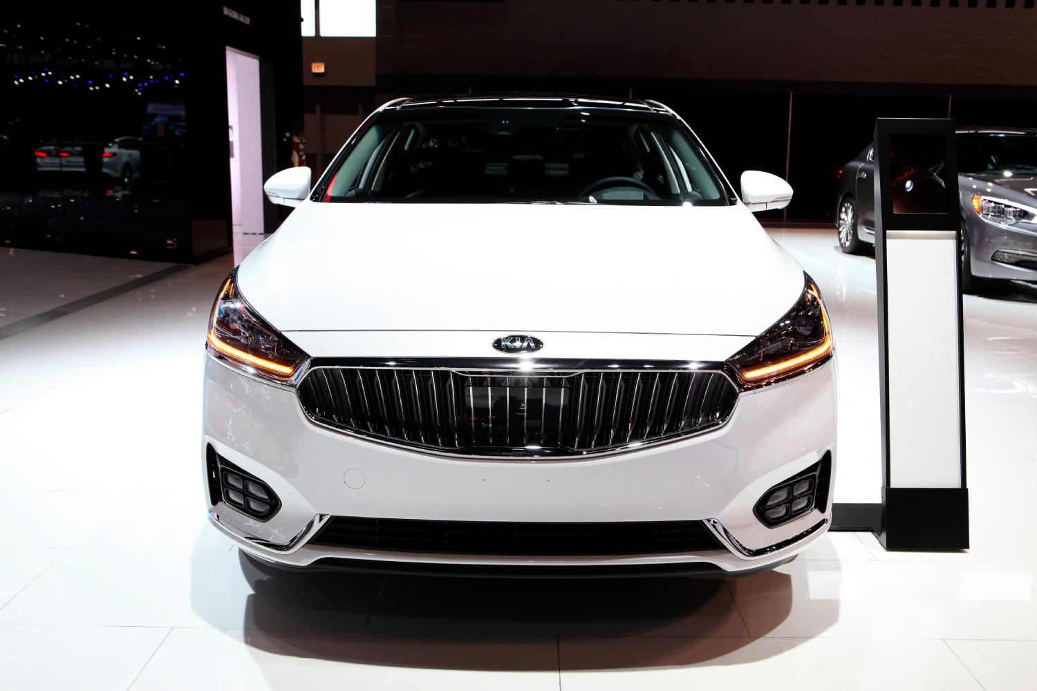 A Kia Cadenza seen from the front at an auto show
