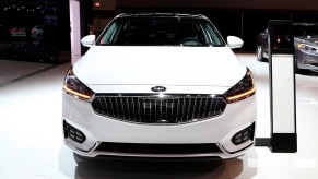 A Kia Cadenza seen from the front at an auto show