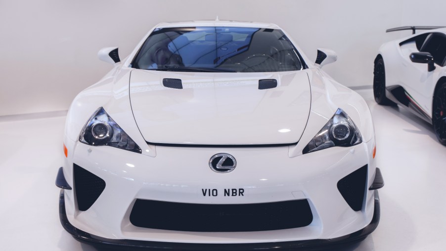 A white Lexus LFA on display at an auto show