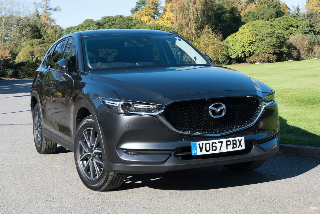 A gray 2017 Mazda CX-5 out on a sunny day