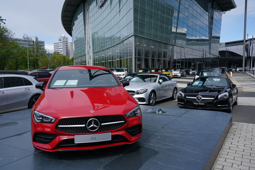 Cars stand on display for sale at a Mercedes-Benz dealership during the coronavirus crisis