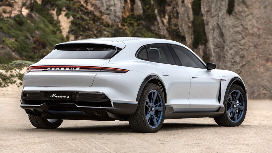 white 2021 Porsche Taycan cross turismo with dynamic presentation in forrest setting.