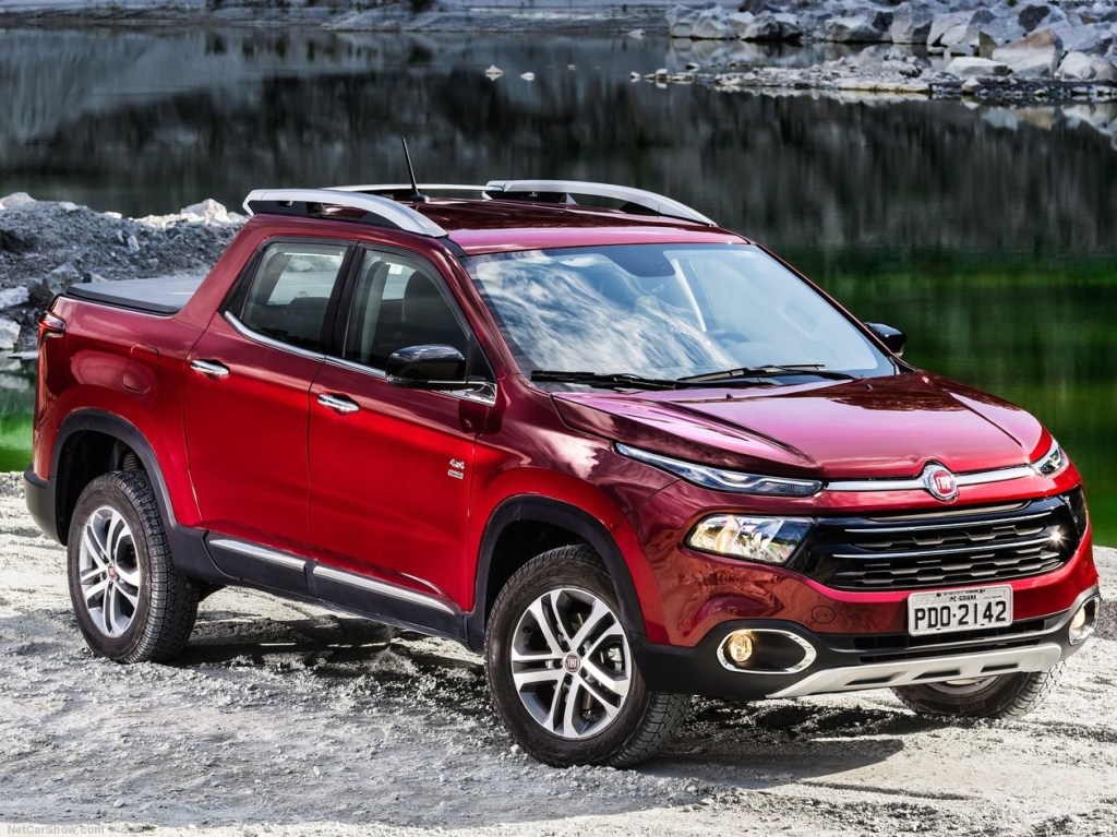 A red Fiat Toro mountainside shot. The Fiat Toro is the base for the Ram 1000