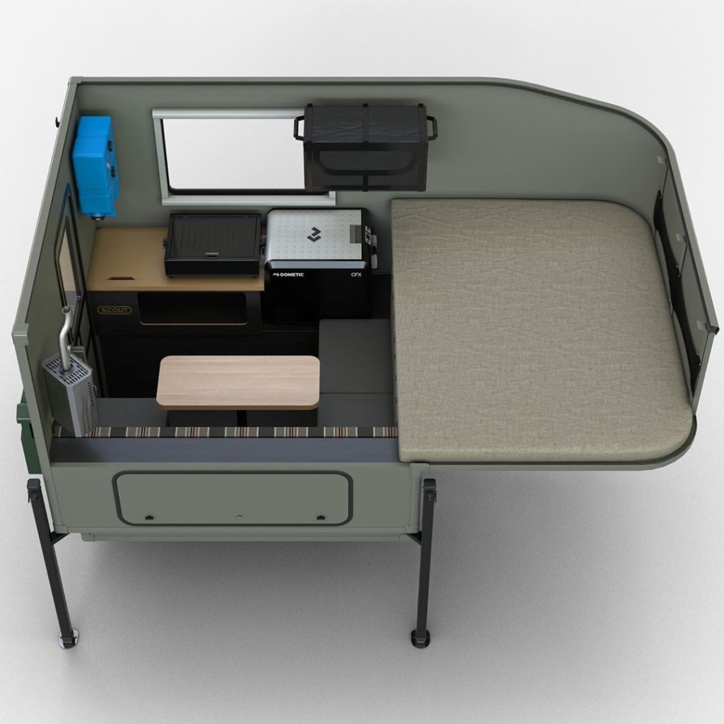 Cutaway image of the Scout Campers Yoho, showing the sleeping area, as well as the optional fireplace and cooktop