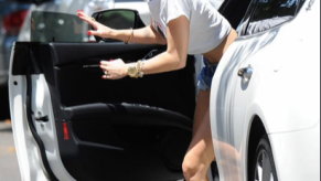 Miley Cyrus stepping out of her Maserati Quattroporte