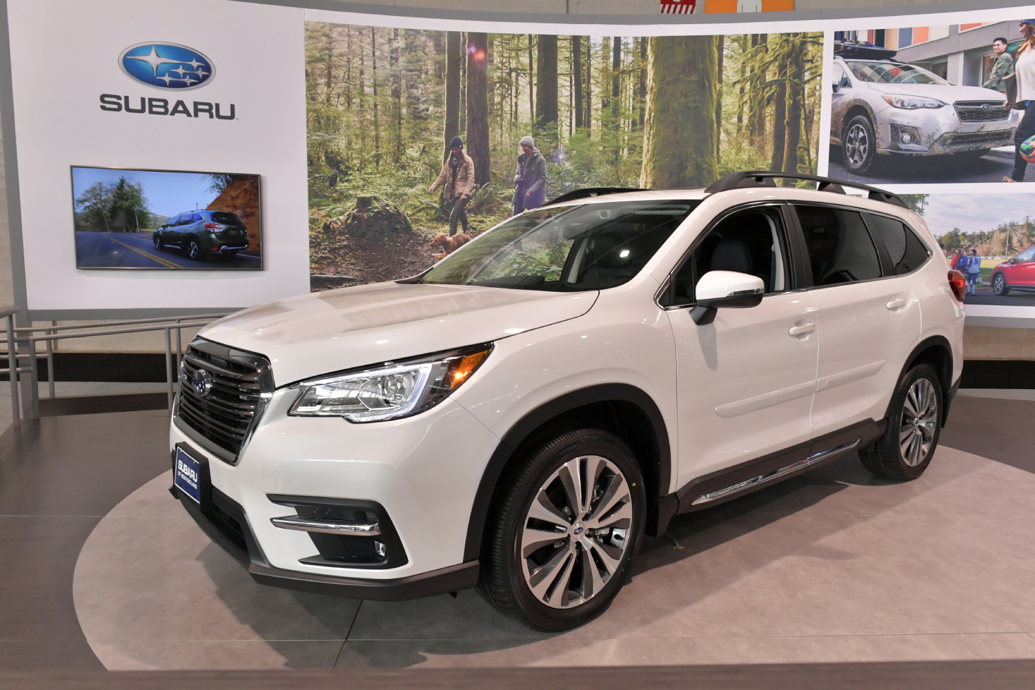 A white Subaru Ascent on display at an auto show