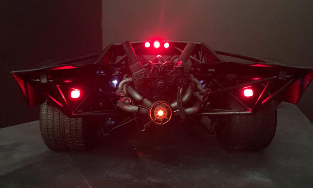 The Batman Batmobile 2021 rear view with glare from red lights showing engine| Frost