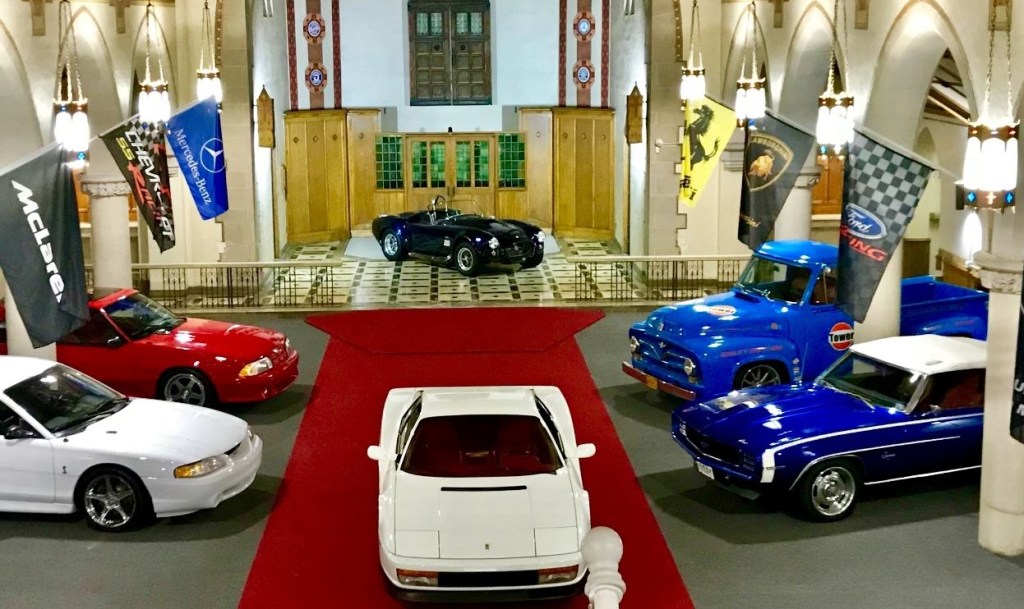 Cars are parked inside an old church