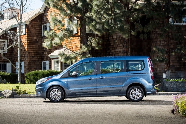 side view of a blue ford transit connect