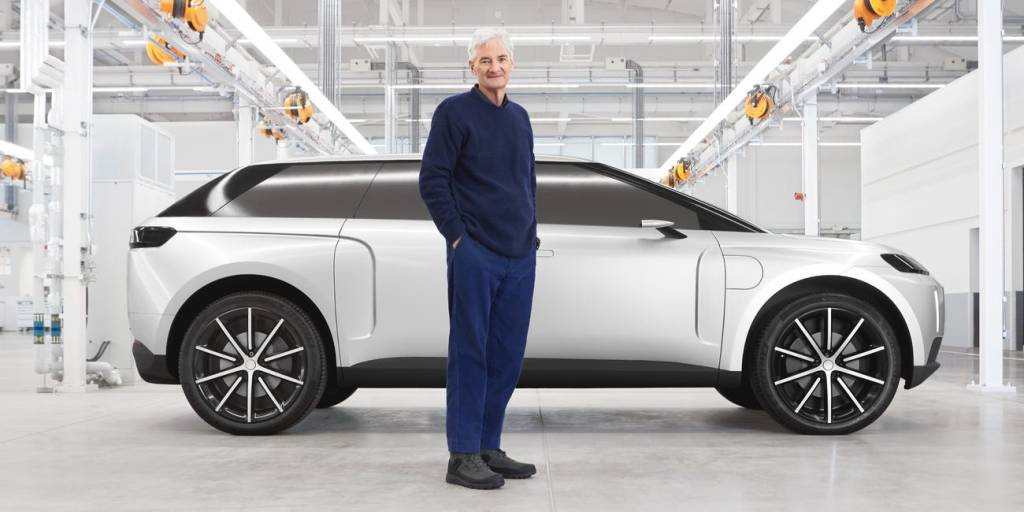 Sir James Dyson standing beside his electric SUV | Dyson