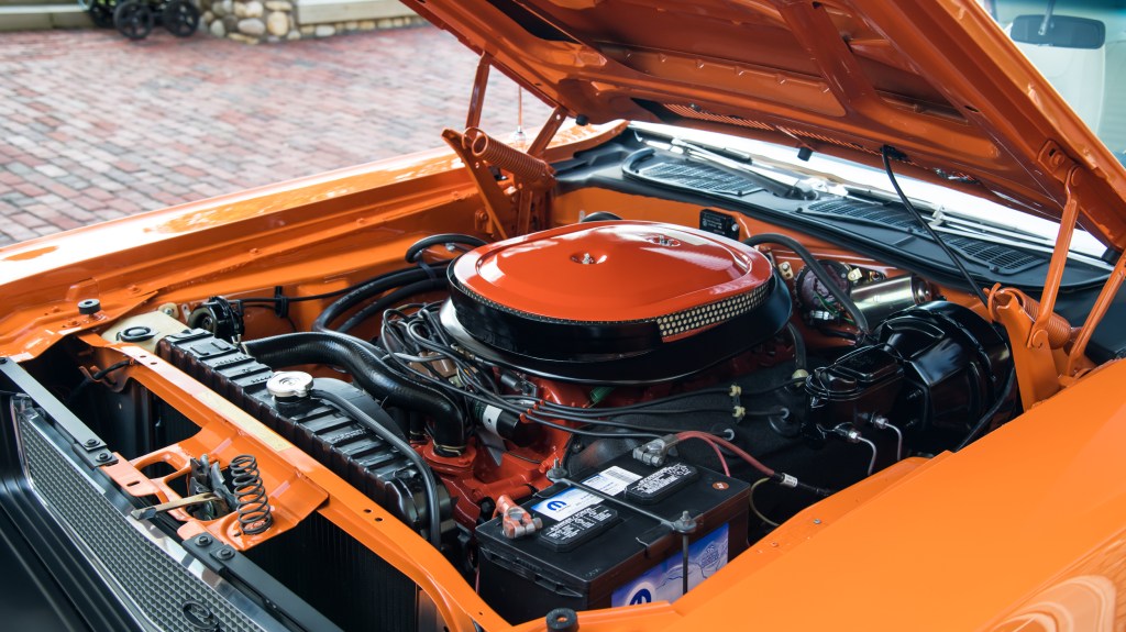 The hood is raised to reveal the 426 Hemi in this Dodge Challenger