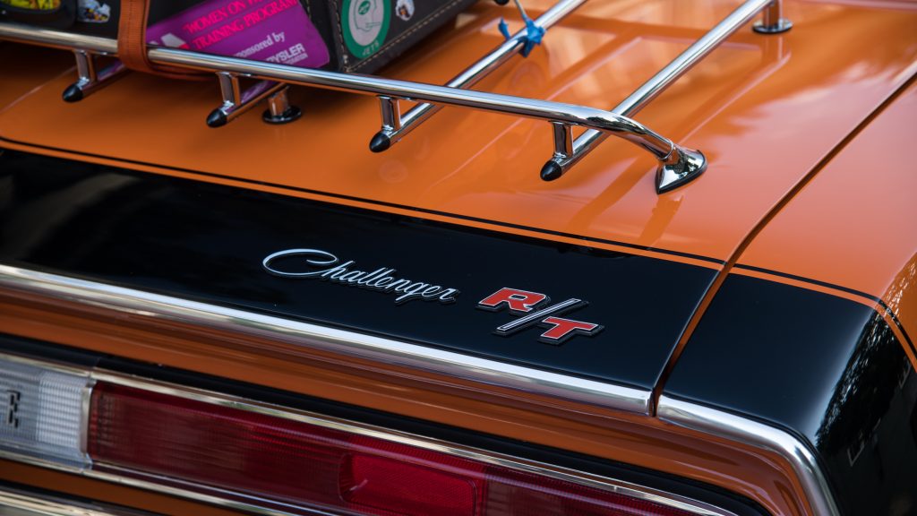 The trunk lid and luggage rack of a Go Mango orange Challenger