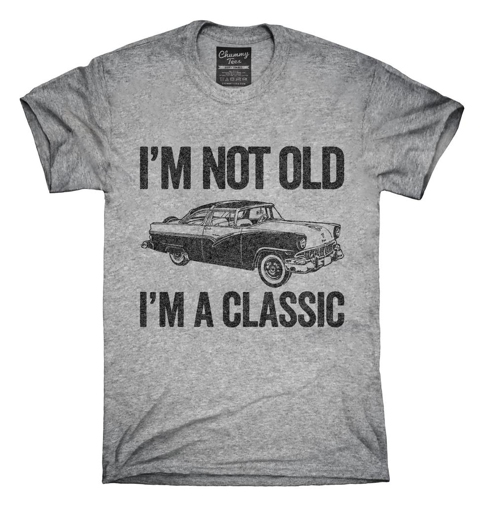 a grey t-shirt bearing the text "I'm not old, I'm a classic" 