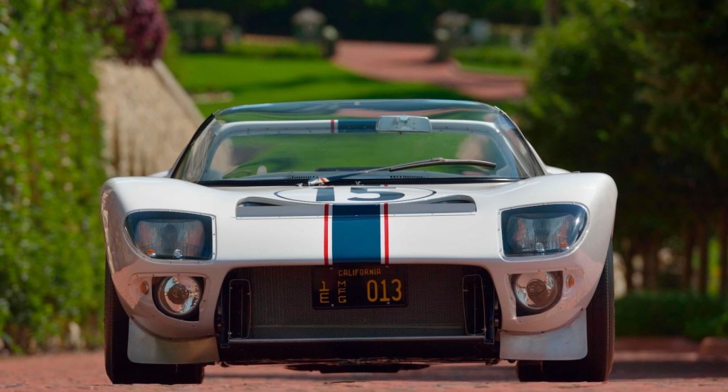 Looking at the white 1965 For GT Roadster head on. 