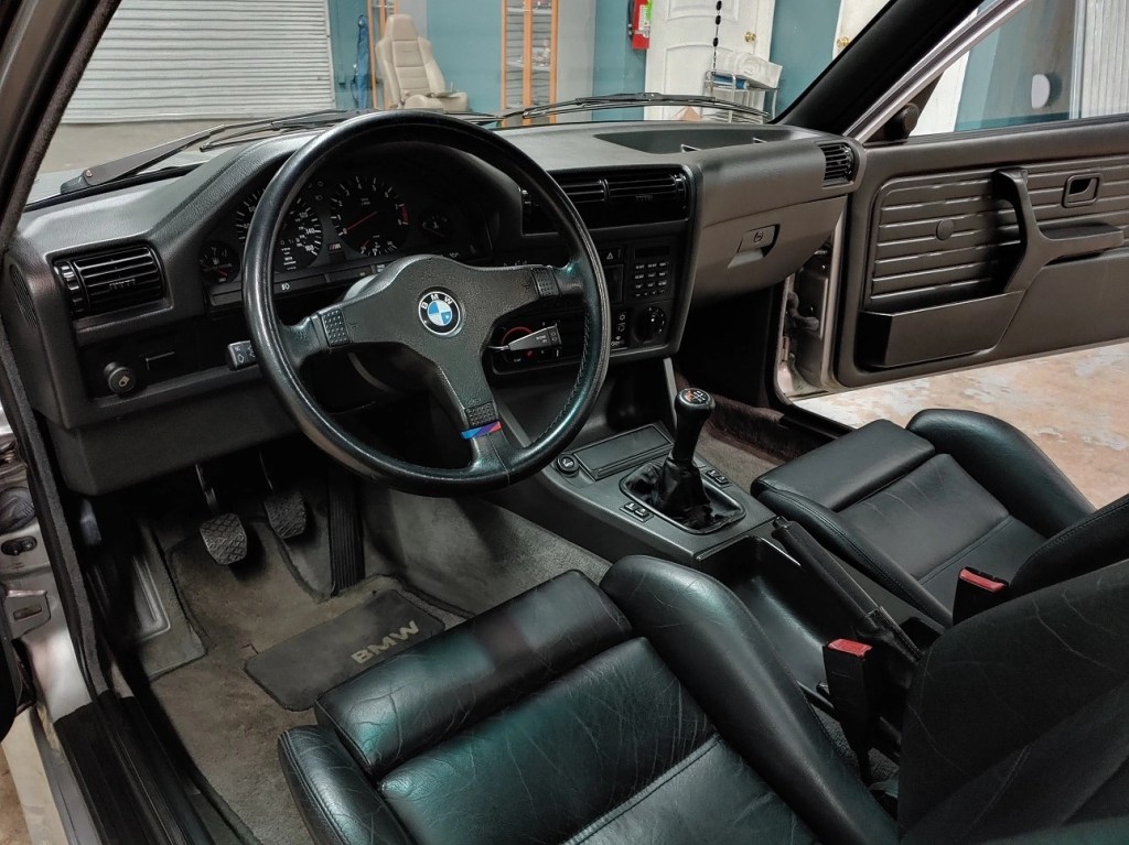 The dashboard and front Recaro seats of a 1988 BMW E30 M3