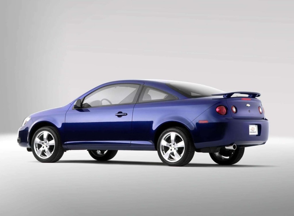 A rear-3/4 view of a blue 2005 Chevrolet Cobalt coupe