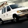 white Ford work van in motion