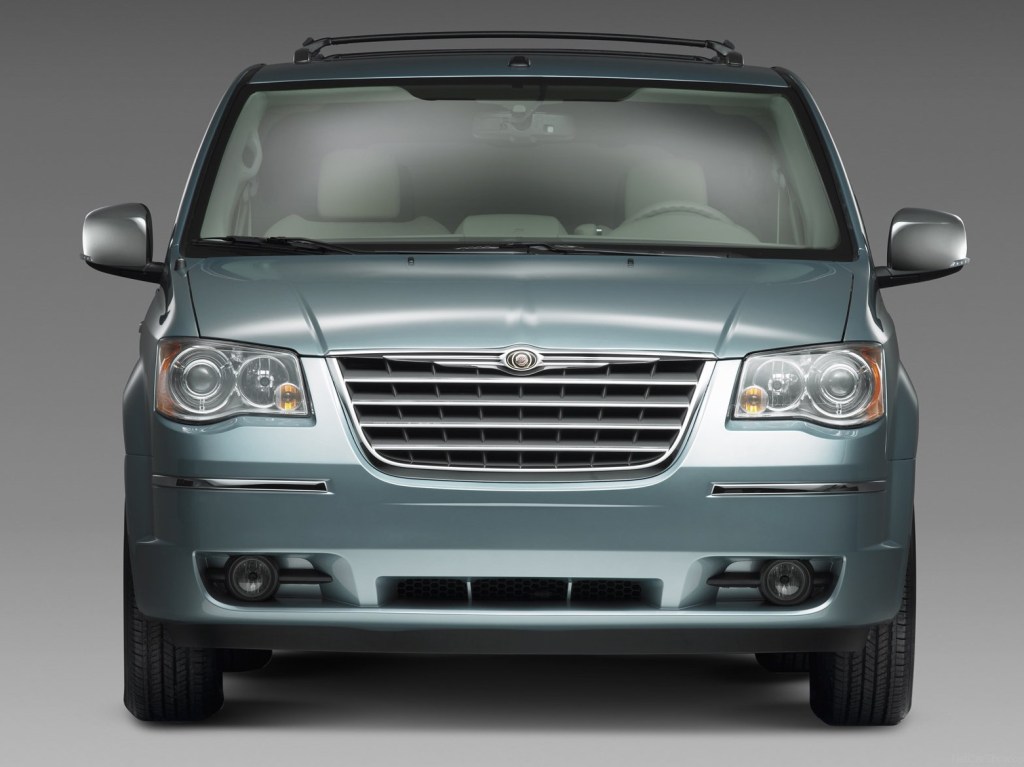 A head-on view of a mist blue Chrysler Town and Country