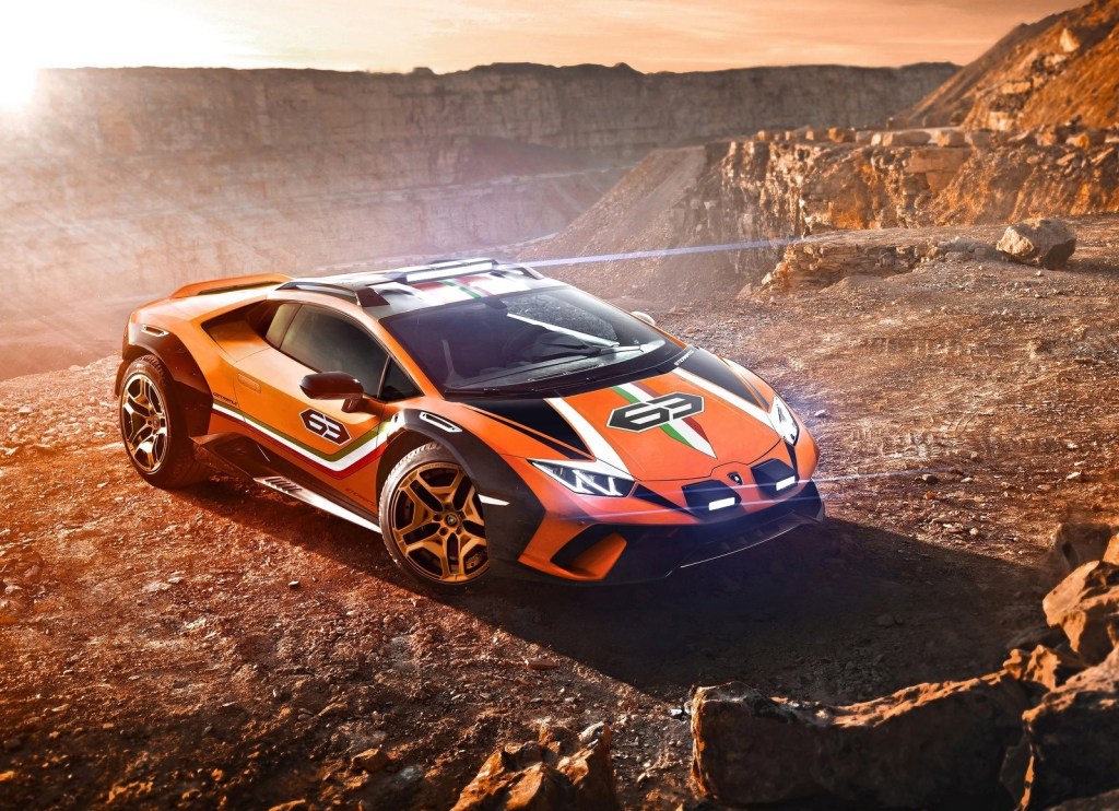 Orange and Tricolore-striped 2019 Lamborghini Huracan Sterrato concept parked overlooking a desert canyon