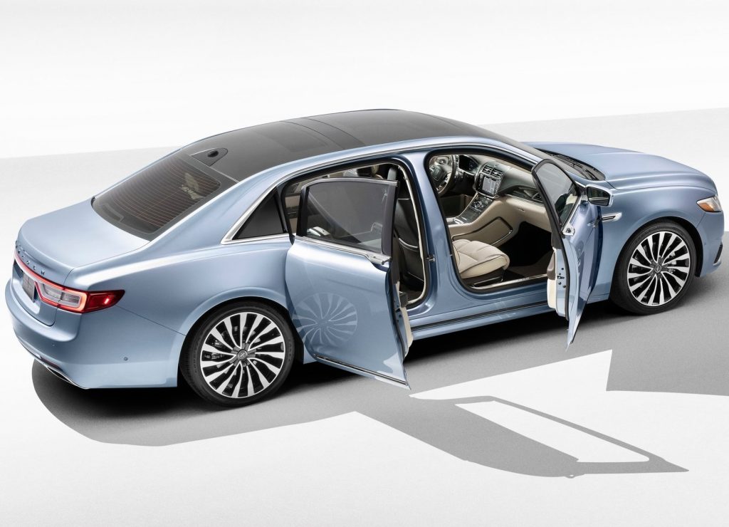 A light-blue 2019 Lincoln Continental 80th Anniversary Edition sedan with its front and rear-hinged rear doors open