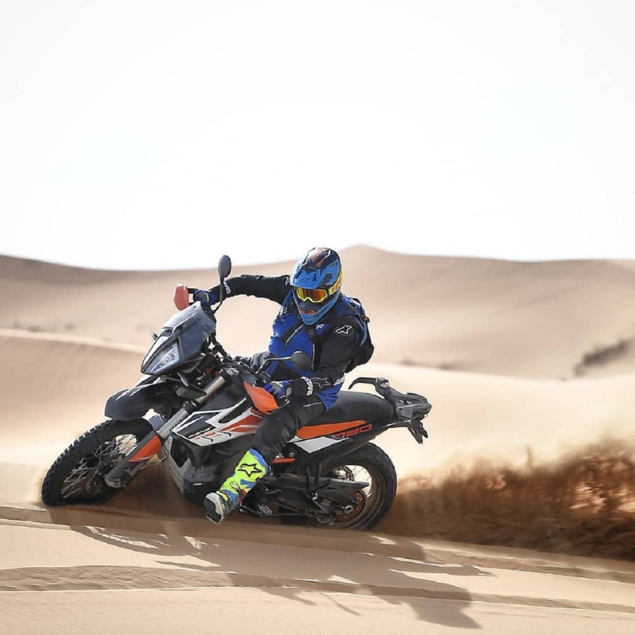 Black-and-orange 2020 KTM 790 Adventure R power-sliding through the desert
