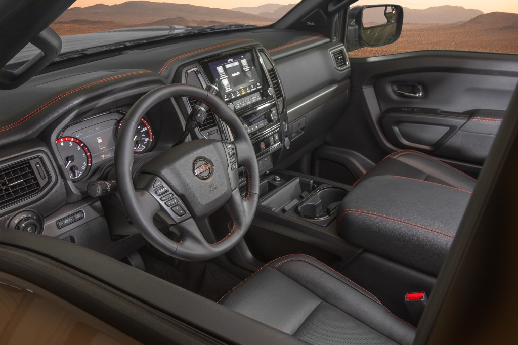 The black-and-red-trimmed interior of the 2020 Nissan Titan Pro-4X