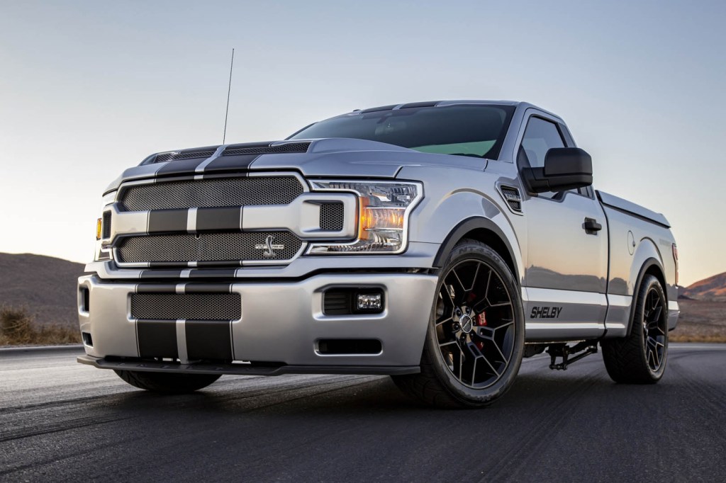 Silver-with-black-stripes 2020 Shelby F-150 Super Snake on a racetrack