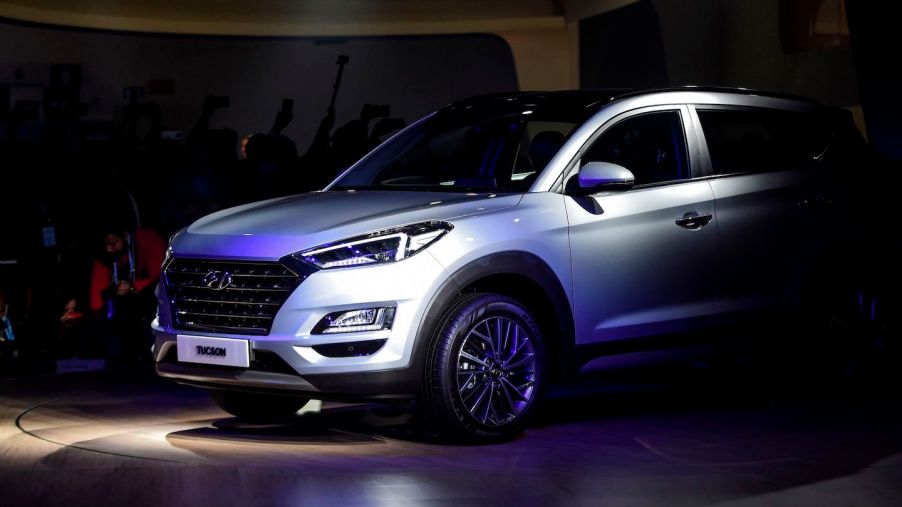 A silver 2020 Tucson is displayed on stage after its launch at the Auto Expo 2020