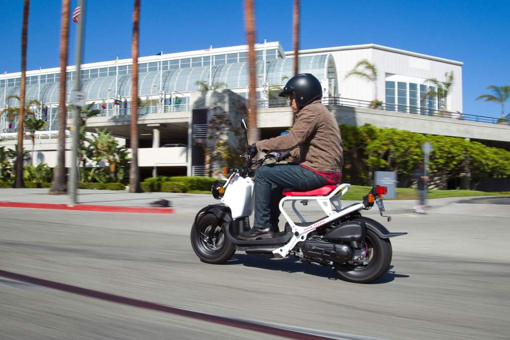 A man riding a Honda Ruckus