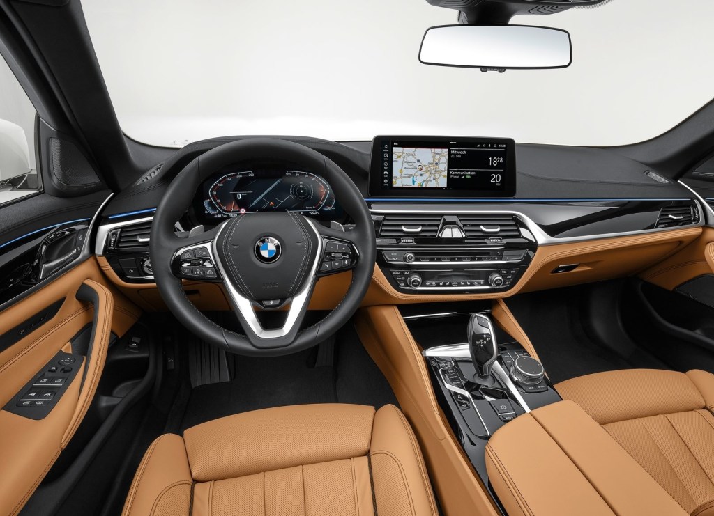 Interior shot of the 2021 BMW 5-Series, showing tan leather seats