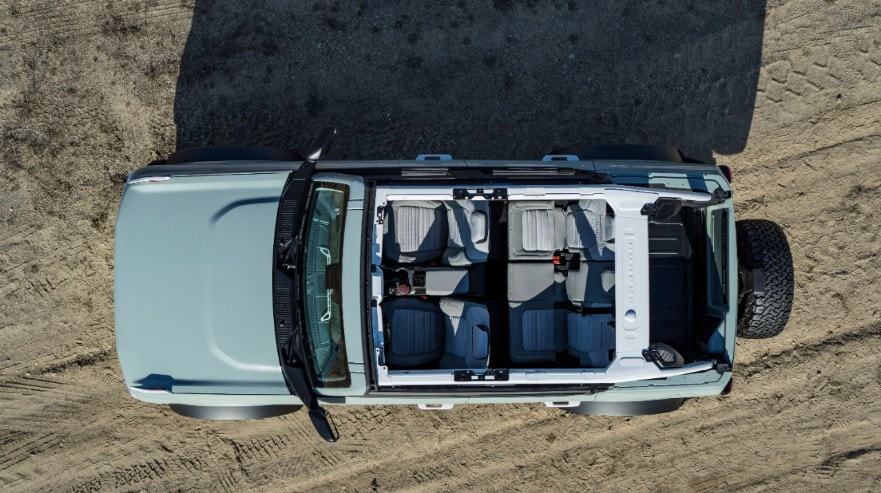 Overhead shot of a blue 2021 Ford Bronco with the roof and doors removed