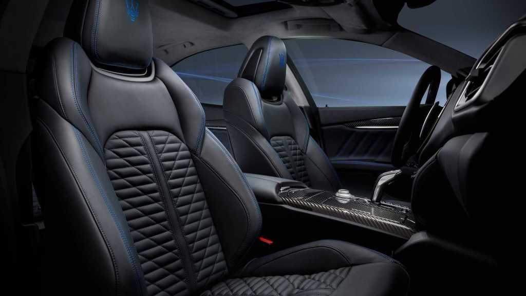 The front seating of the Maserati Ghibli shows the blue stitching.