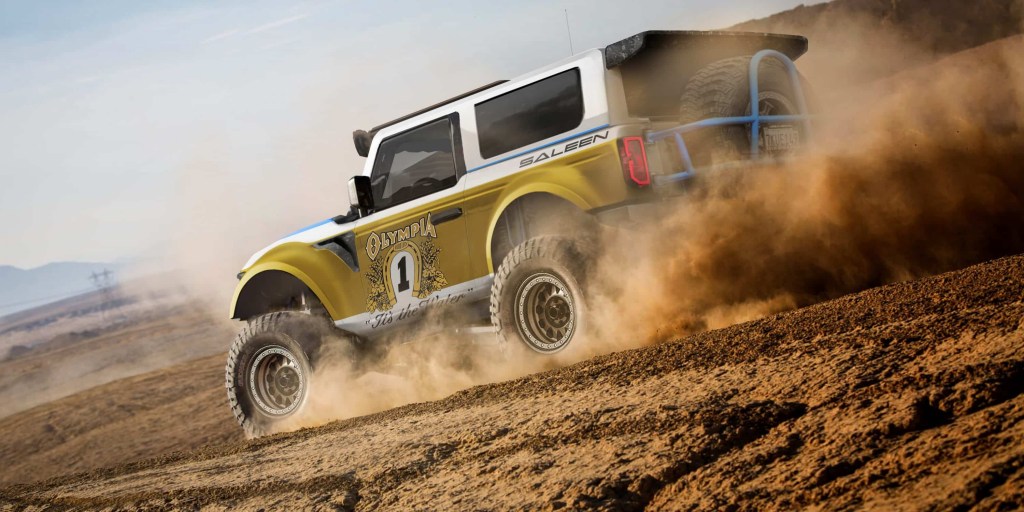 The rear of a gold and white 2021 Bronco looks race prepared.