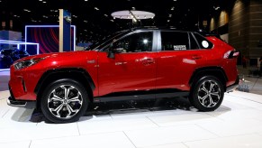 A red 2021 RAV4 Prime on display at the 112th Annual Chicago Auto Show