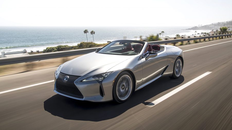 A silver, topless 2021 Lexus LC 500 on a coastal road.