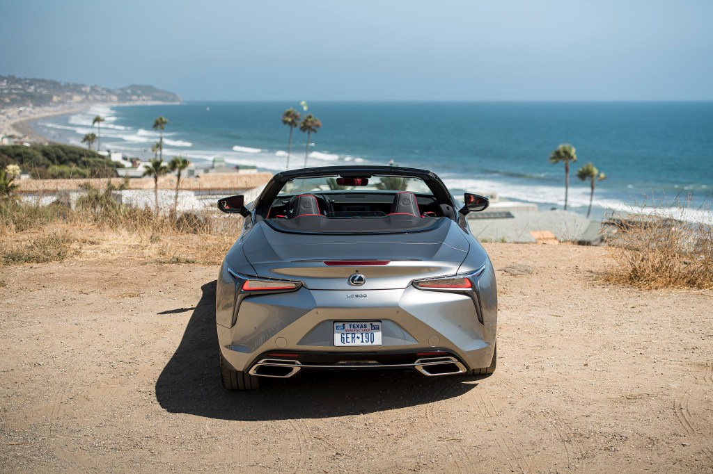 A silver, topless 2021 Lexus LC 500 Convertible is parked on the beach.