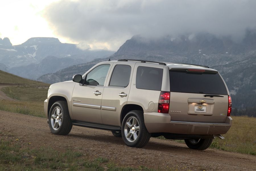 a gold 2010 used Chevy Tahoe in the mountains
