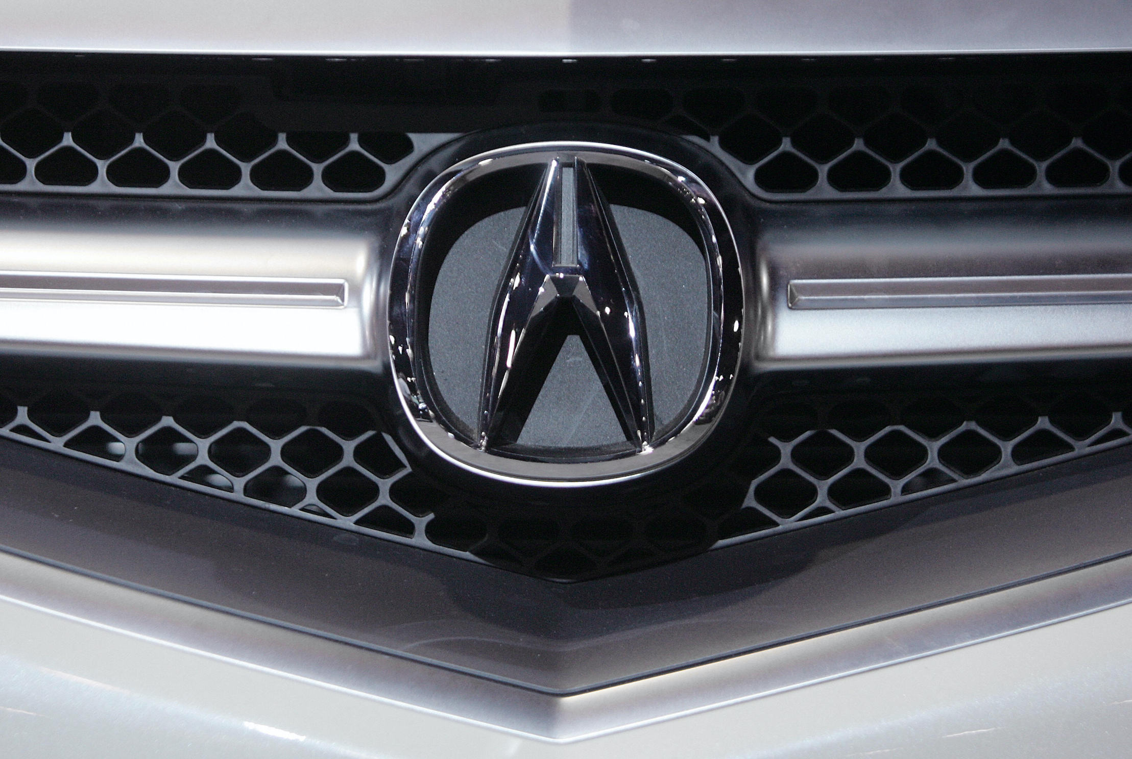 The logo for Japanese automaker Acura can be seen on the grill of a 2007 model displayed at the South Florida International Auto Show