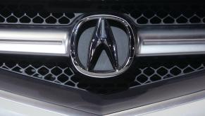The logo for Japanese automaker Acura can be seen on the grill of a 2007 model displayed at the South Florida International Auto Show