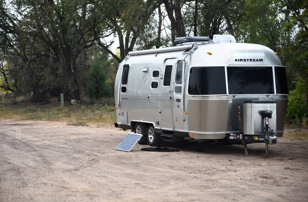 An Airstream travel trailer with a solar panel kit