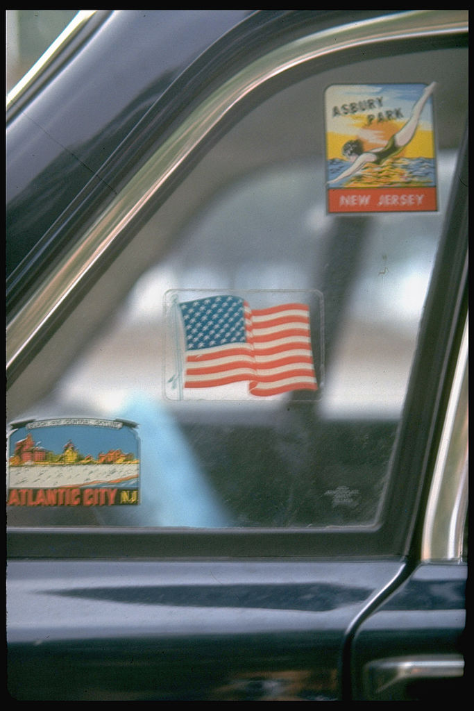 Old decals in window of car