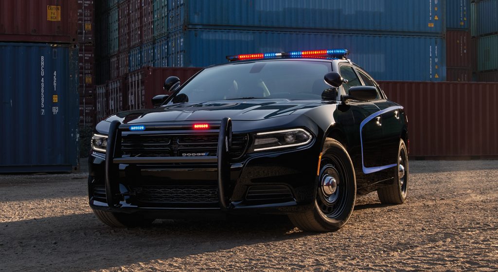 A look at the front of the a black Dodge Charger with a push bar.