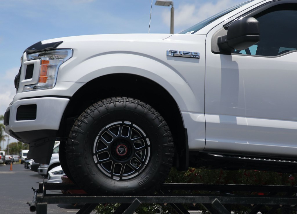 A Ford F-150 pickup truck – a competitor to the Chevy Silverado – is seen on a sales lot on May 10, 2018 in Miami, Florida.