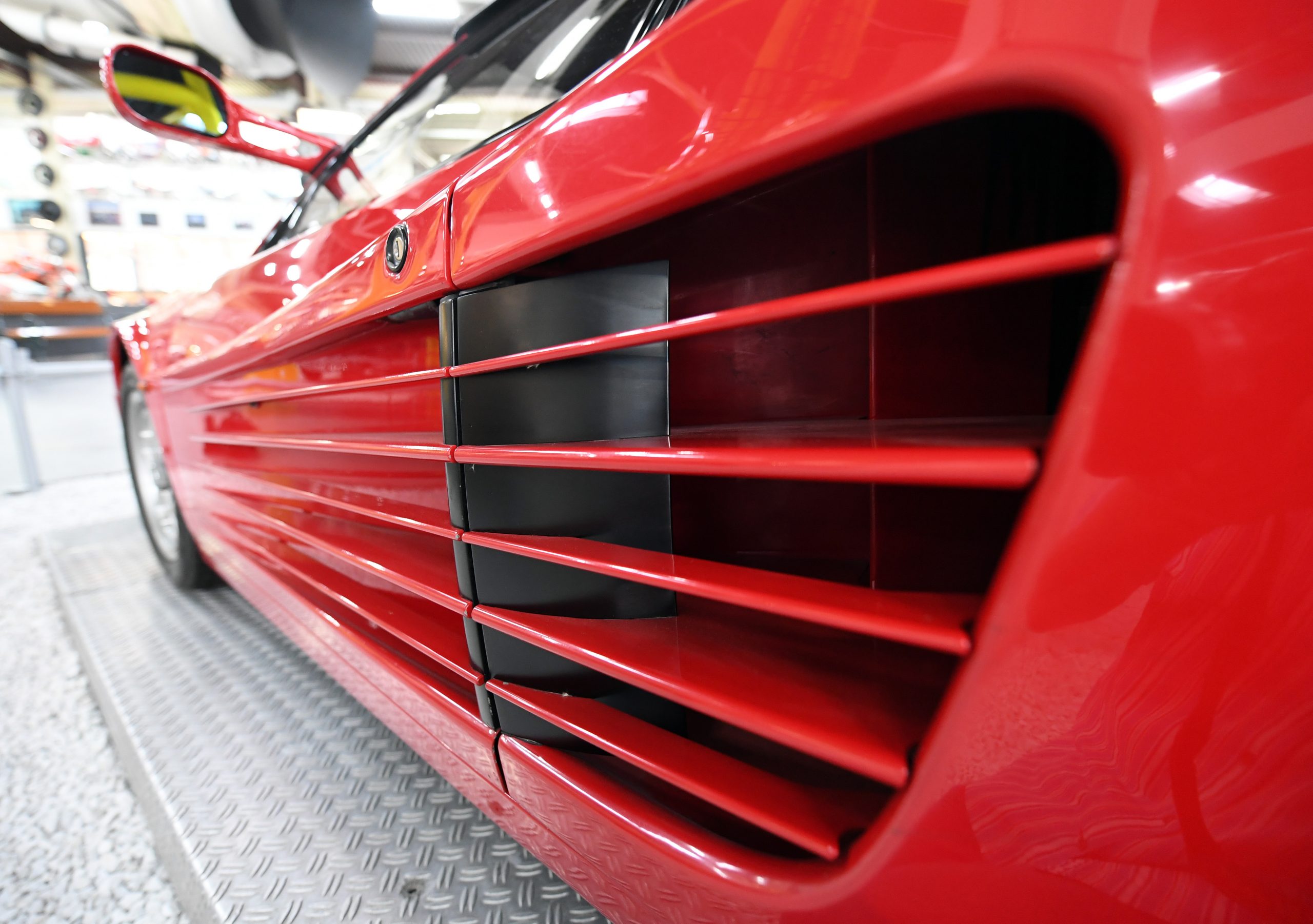 The drivers side door strakes leading to the air inlet for the engine or a red Ferrari Testarossa.
