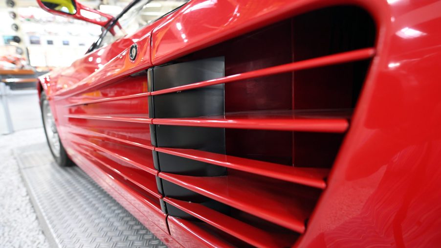 The drivers side door strakes leading to the air inlet for the engine or a red Ferrari Testarossa.