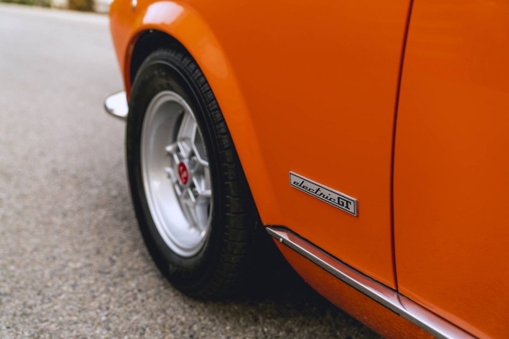 The driver's front fender shows an Electric GT badge to disclose the cars electric motivation.